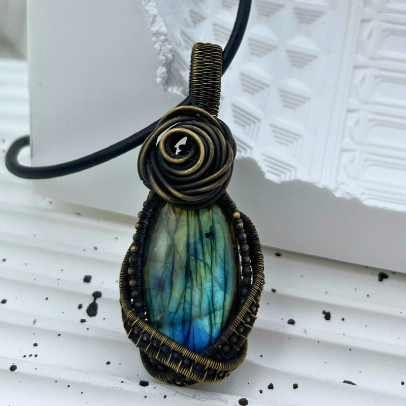 Neptune's Heart: Oceanic Labradorite Pendant with Intricate Silver Sea Foam Frame