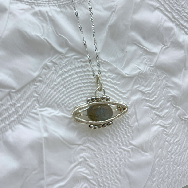 Dream Guardian: Mystical Labradorite Eye Pendant with Intricate Silver Frame